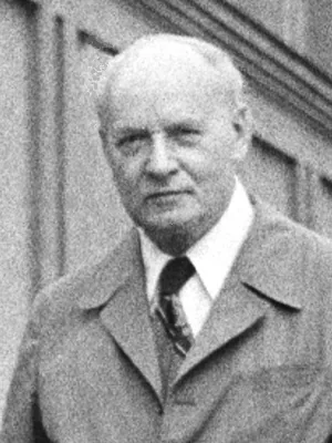 Black-and-white photograph: an elderly Marian Mazur in a coat and tie.